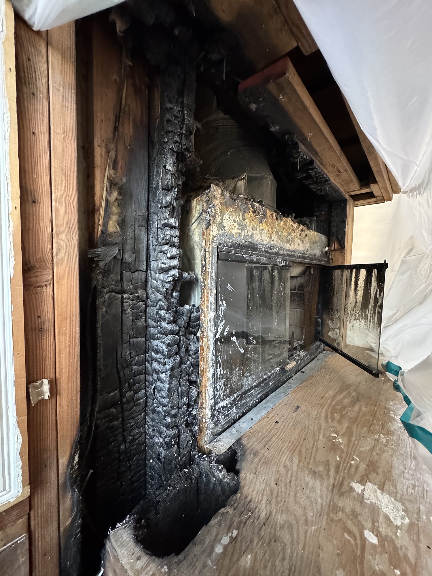 residential-fire-09-fireplace-charred-framing Charred framing around a fireplace and firebox after a residential chimney fire in San Diego